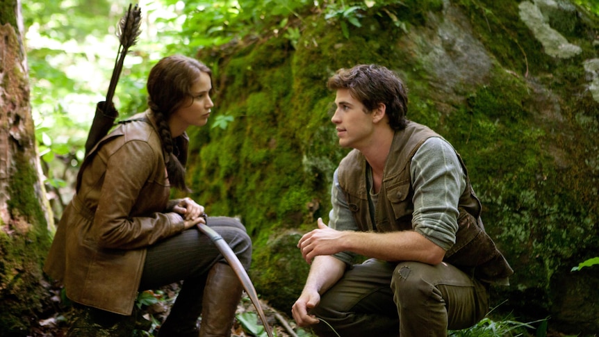 Jennifer Lawrence and Liam Hemsworth in a scene from The Hunger Games (Lionsgate/Murray Close)