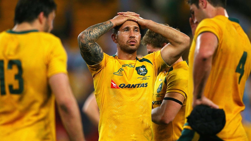 Night to forget ... Quade Cooper and his Wallabies team-mates show their dejection