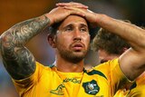 Night to forget ... Quade Cooper and his Wallabies team-mates show their dejection