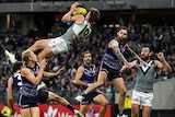 Mitch Georgiades soars high above the pack as he completes a high-flying mark