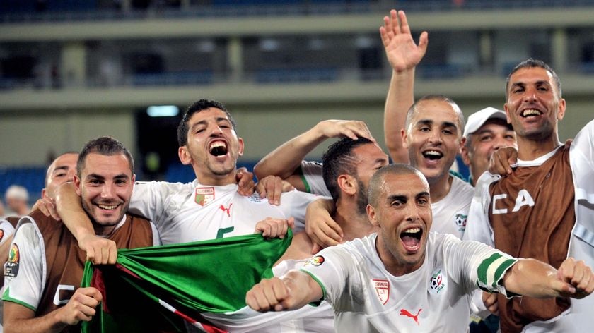 Algeria's players celebrate their qualification for the semi-finals of the Africa Cup