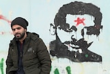 Fadi Zebar and a picture of brother Imad in Kobar village.