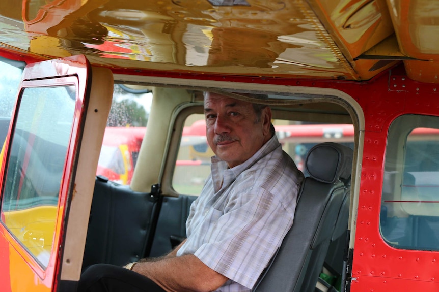 Harry Mitchell, general manager of Australian Aerial Patrol, sits in a cockpit.