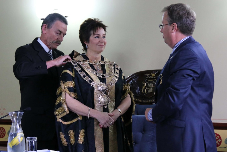 Hobart Lord Mayor Sue Hickey has ceremonial chains adjusted after she is installed.