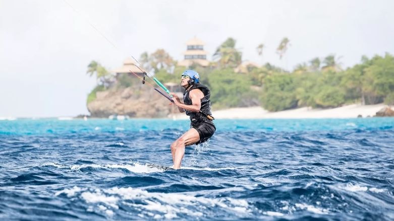 Barack Obama learns how to kitesurf with Richard Branson in the British Virgin Islands.