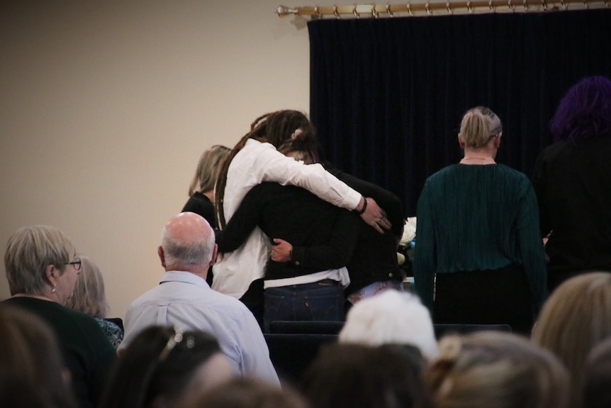 Family embrace at funeral service for Shyanne-Lee Tatnell.