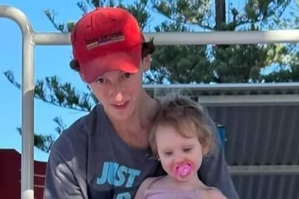 boy in cap with small girl