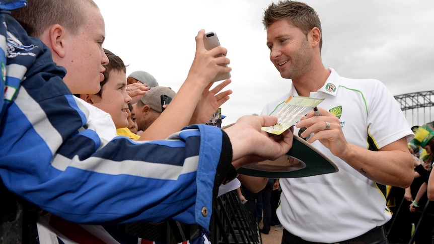 Michael Clarke signs autographs at the Sydney Opera House during celebrations.