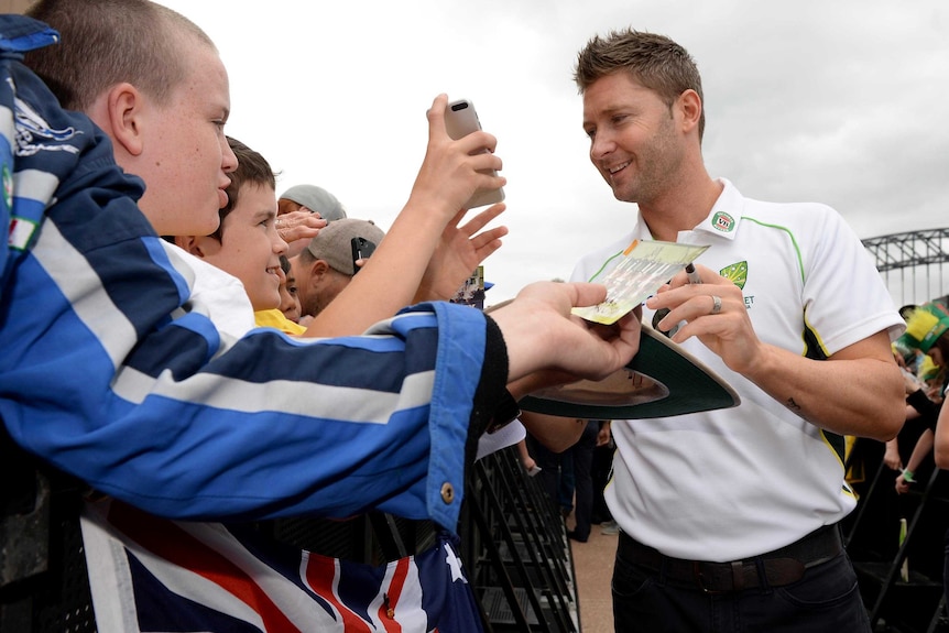 Michael Clarke signs autographs at the Sydney Opera House during celebrations.