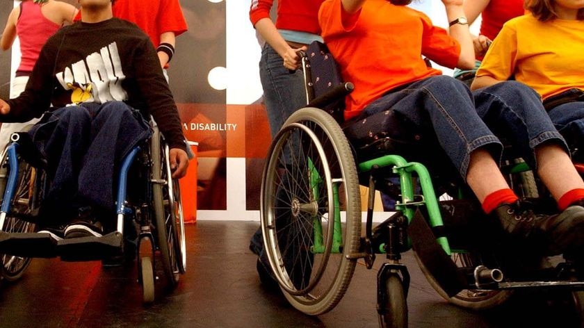 Children with disabilities dance onstage