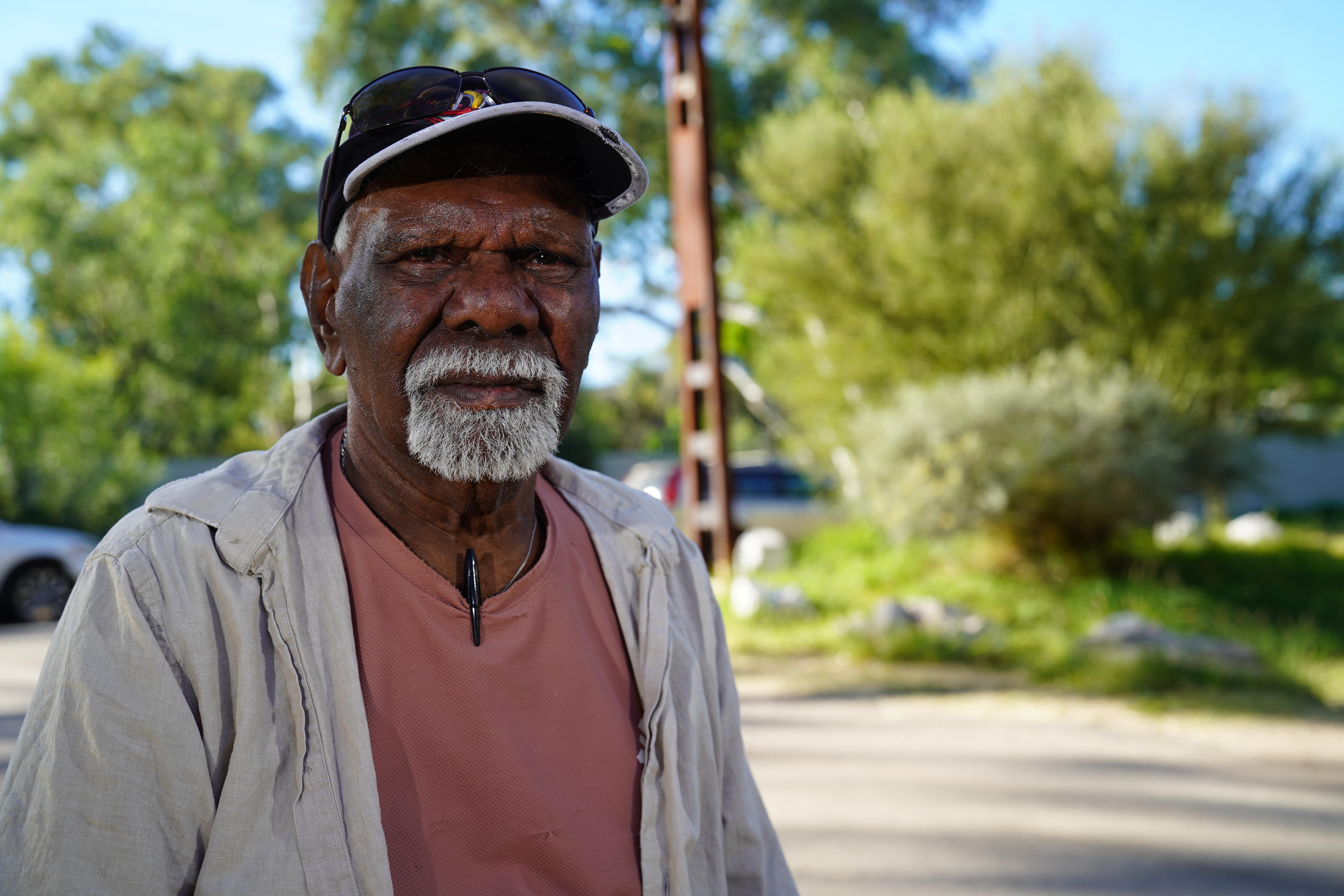 Robin sits outside the town camp