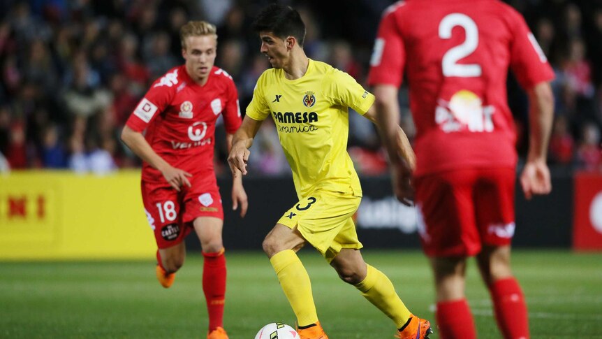 Villarreal's Gerard looks to pass the ball between