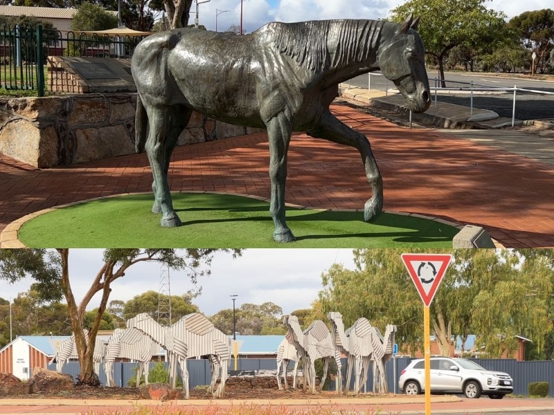 A picture of the horse statue and the tin camels on the roundabout
