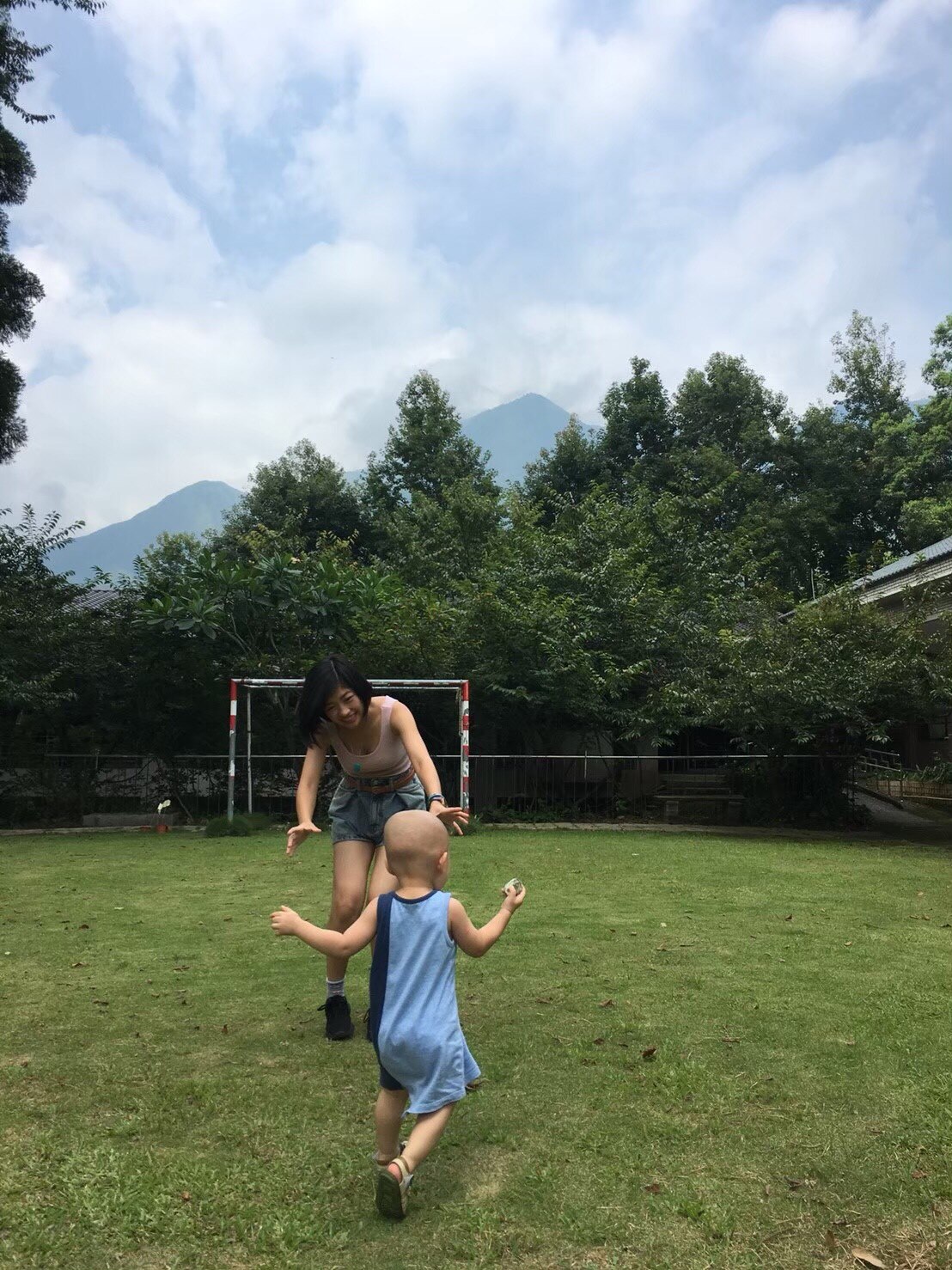 Taiwanese woman Yuke Chen plays with a young child in her hometown in Nantou county.