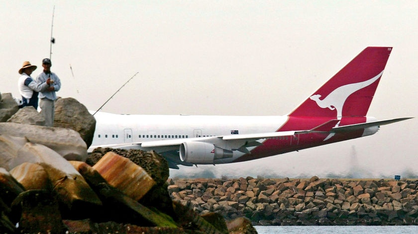 A Qantas jumbo jet takes off.