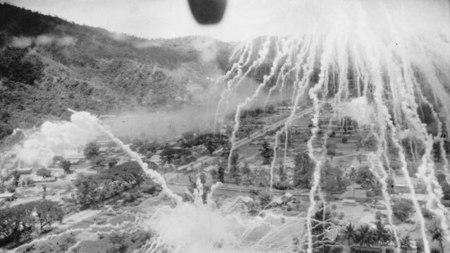 Black and white photo of Rabaul bombing raid.