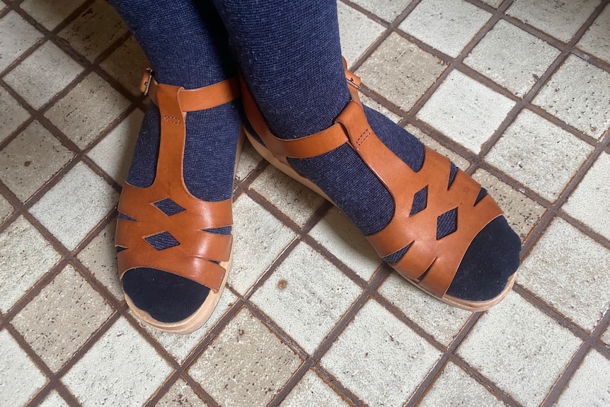 brown sandals with blue socks