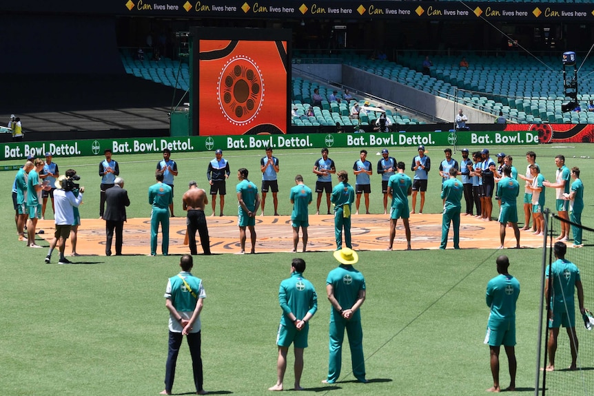 Australian and Indian players participate in a Barefoot Ceremony at the SCG.