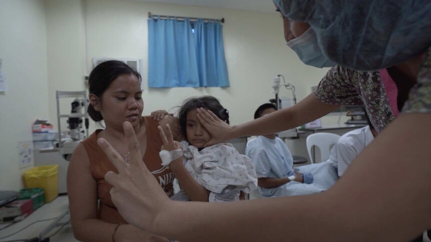 Maia Janella Garcia, 7, counting fingers after surgery.