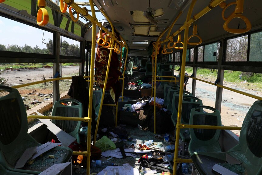 The interior of a damaged bus is seen after an explosion at insurgent-held al-Rashideen.