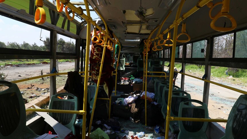 The interior of a damaged bus is seen after an explosion at insurgent-held al-Rashideen.