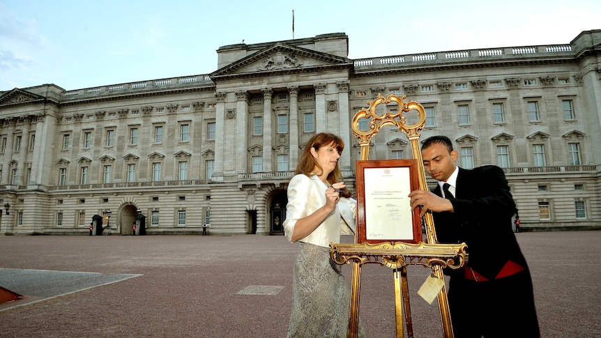 A notification announcing the birth of a baby boy is placed in the forecourt of Buckingham Palace.