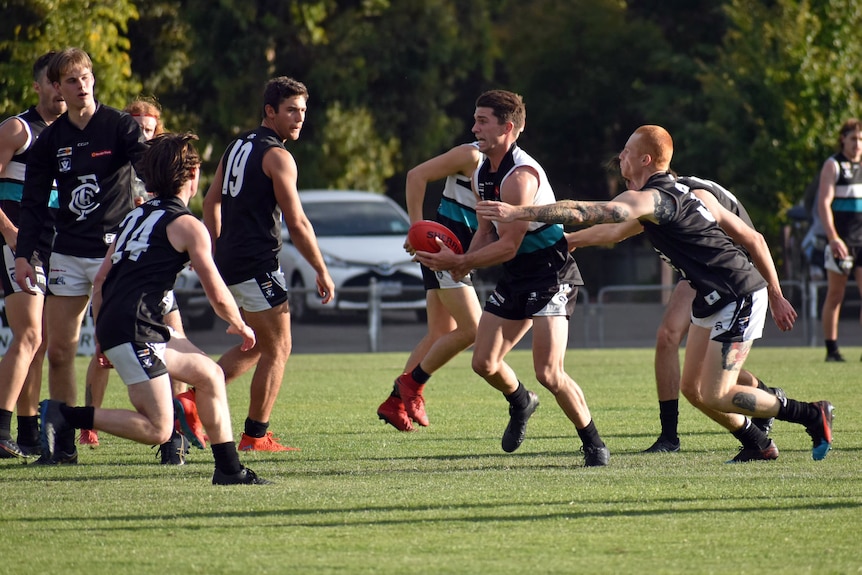 An Aussie rules tackle.