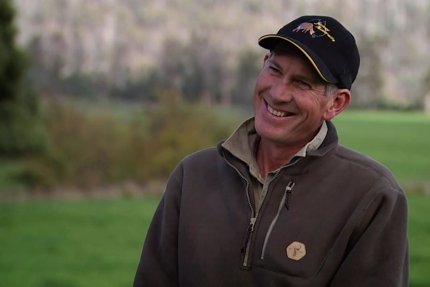 Man smiles on a dairy farm