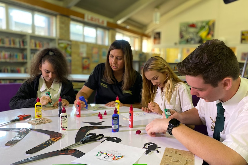 a group of students painting