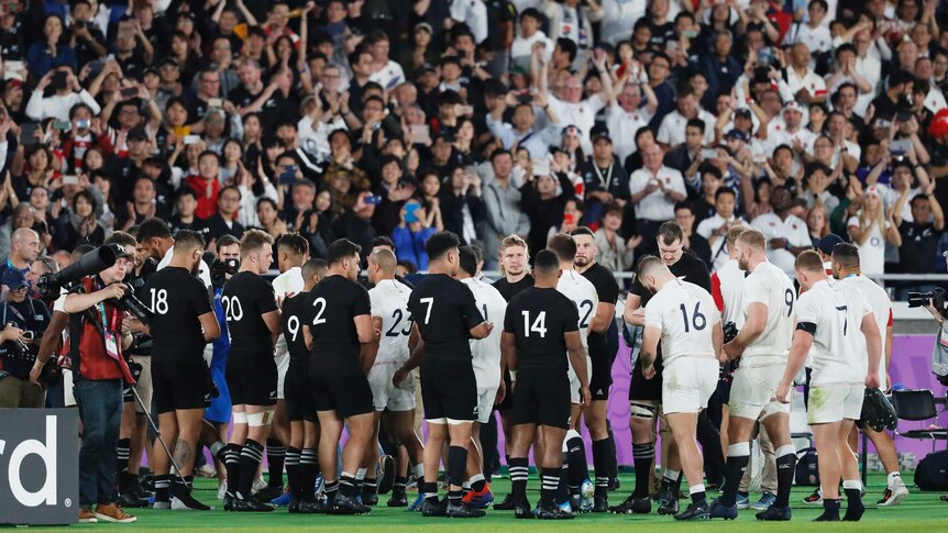 New Zealand rugby players give England players a guard of honour after their Rugby World Cup semi-final.