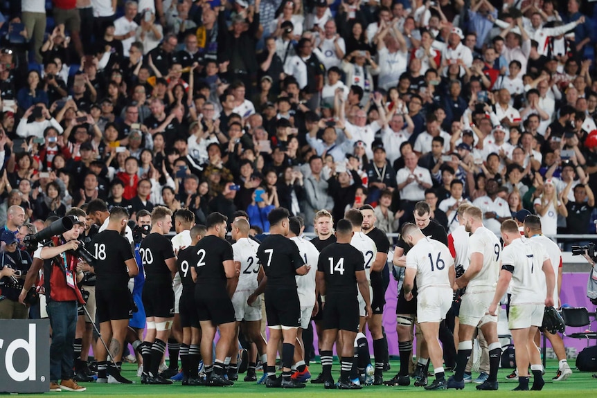 New Zealand rugby players give England players a guard of honour after their Rugby World Cup semi-final.