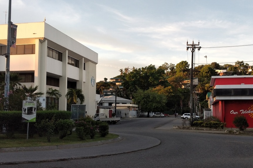 Buildings, a street and trees