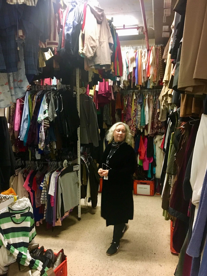 Julie Adams surrounded by costumes in the ABC wardrobe department.