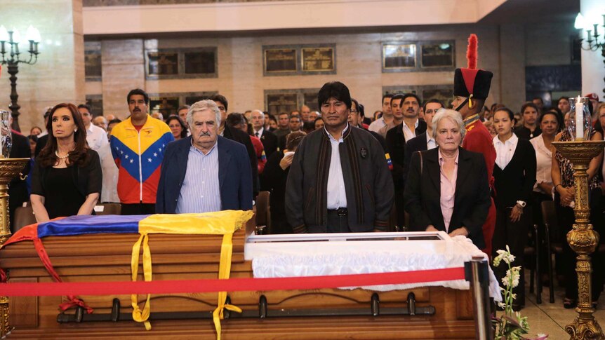Latin American leaders stand next to the coffin of late Venezuelan president Hugo Chavez