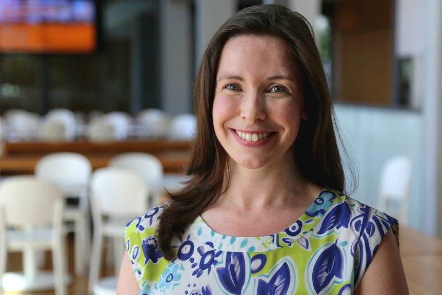 woman smiling in a hospital cafeteria