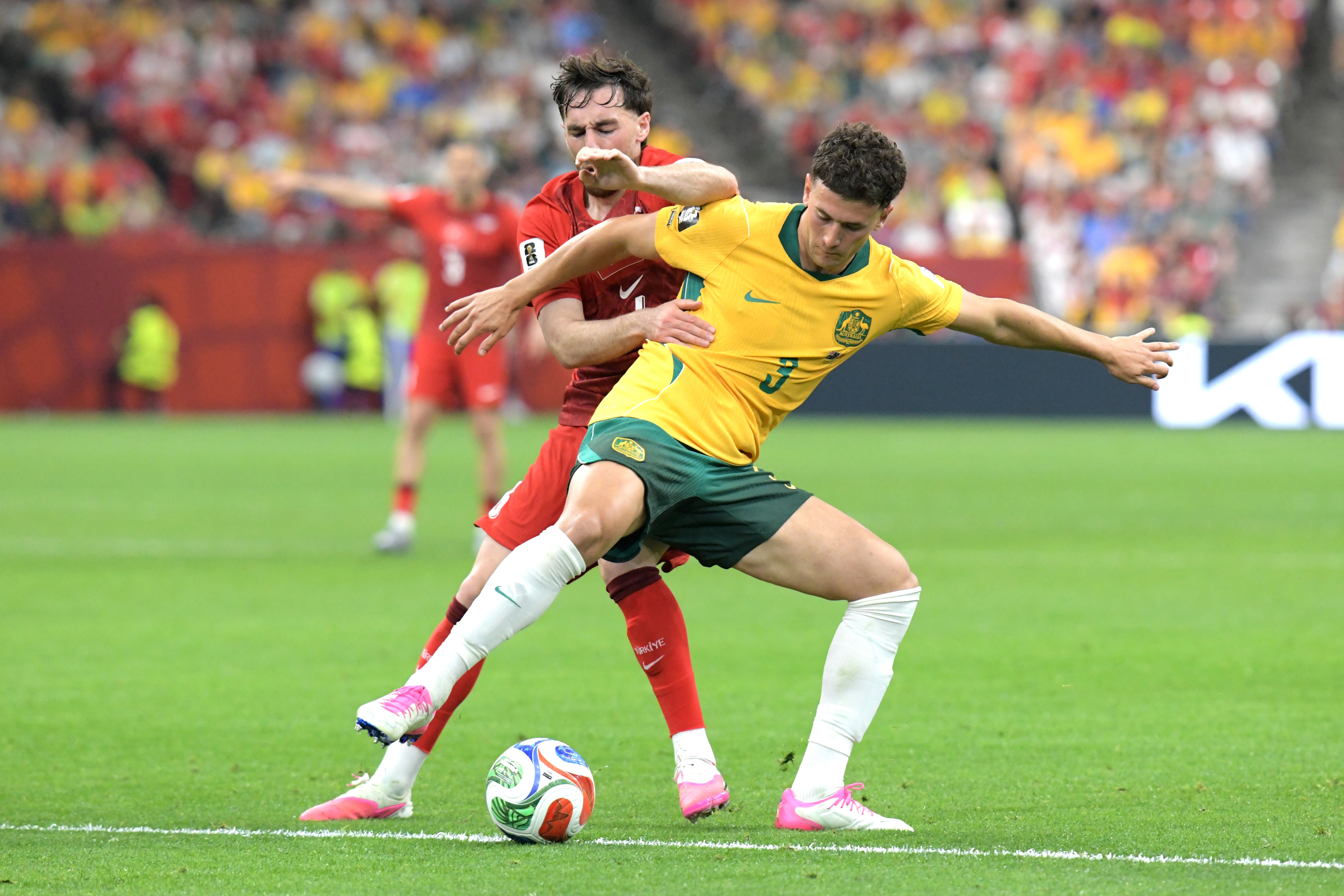 Alessandro Circati of Australia men football team and Orkun Kokcu of the Türkiye men football team
