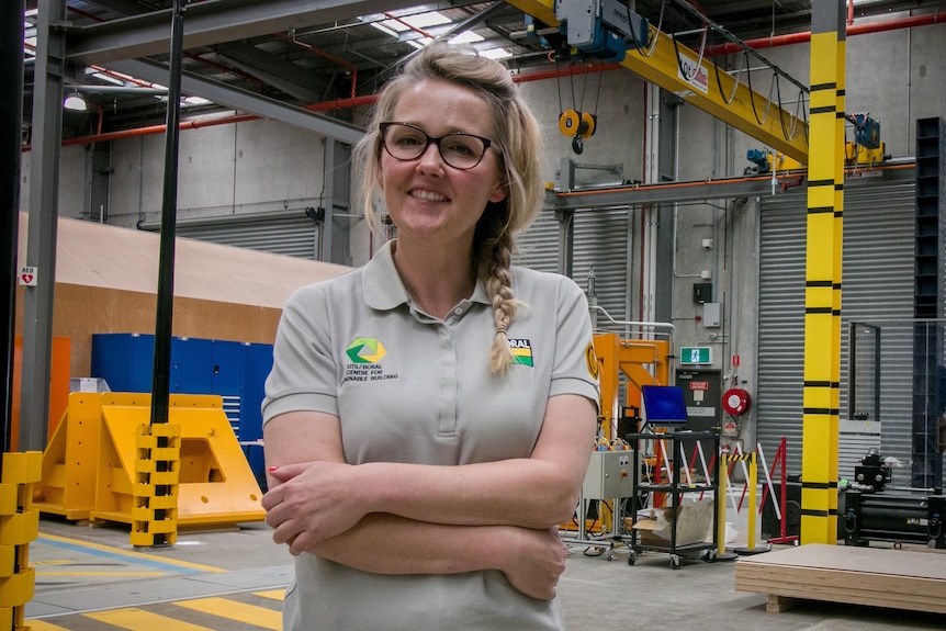 Louise Keyte stands with her arms crossed.