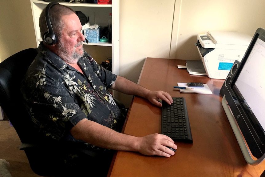 Matthew Faulkner sitting at his computer