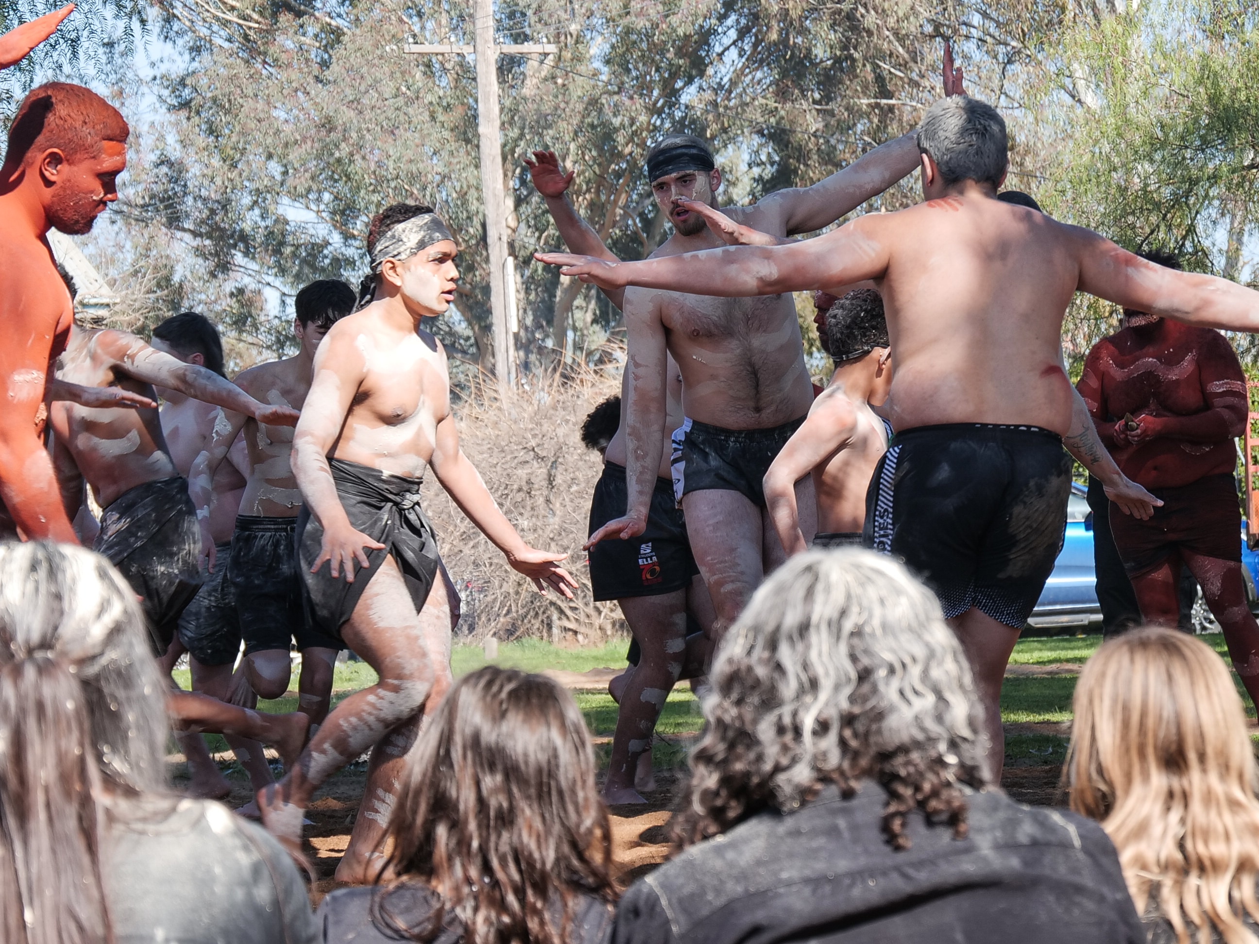 People doing an Indigenous Australian dance.