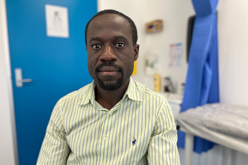 Man wearing striped shirt. 