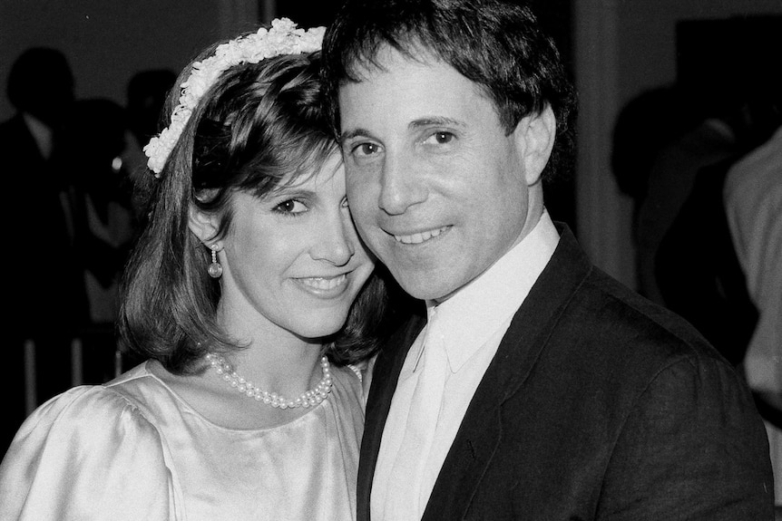 Carrie Fisher with musician Paul Simon, 1983
