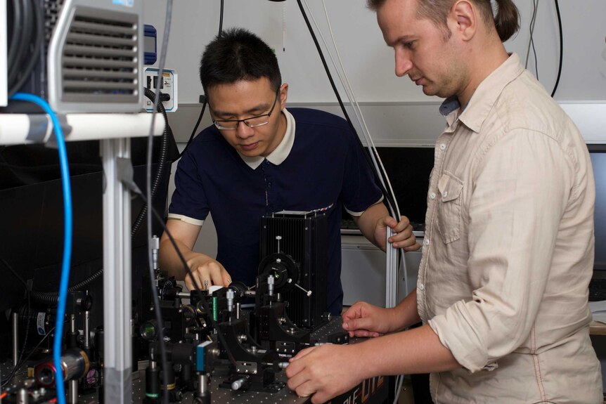 PhD researcher Lei Wang and Doctor Sergey Kruk conduct research on holographic technology at the Australian National University.