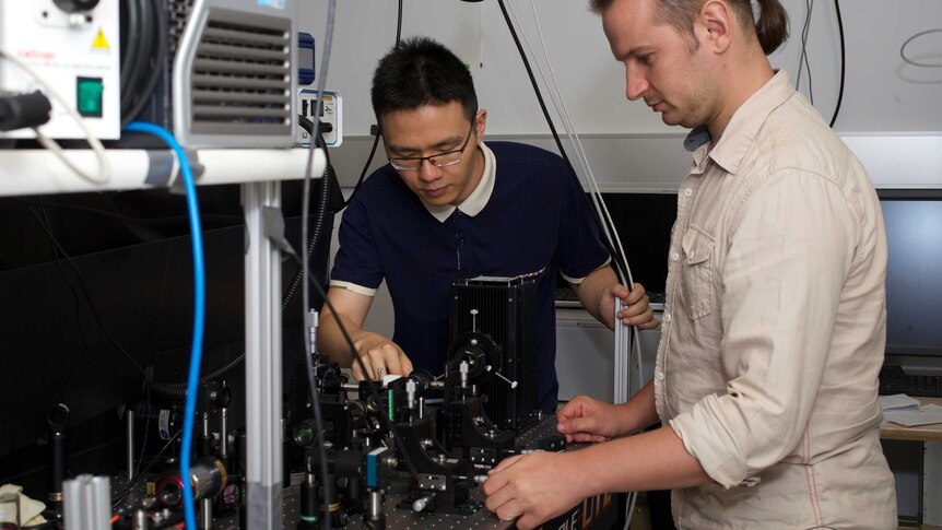 PhD researcher Lei Wang and Doctor Sergey Kruk conduct research on holographic technology at the Australian National University.