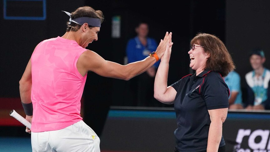 Rafael Nadal high-fives Deb Boirg at the Australian Open's Rally For Relief.