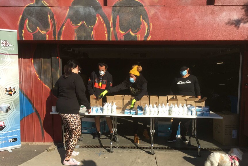 The Victorian Aboriginal Community Controlled Health Organisation handing out sanitiser