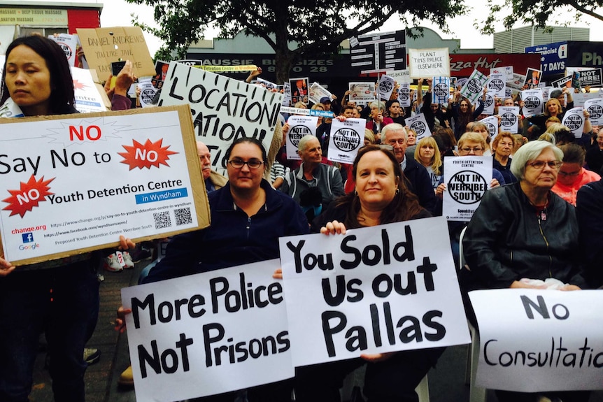 Werribee South Protesters hold "More police not prisons" and "You sold us out Pallas" signs.