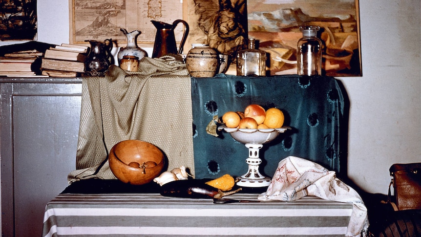 A bowl of fruit on a table.