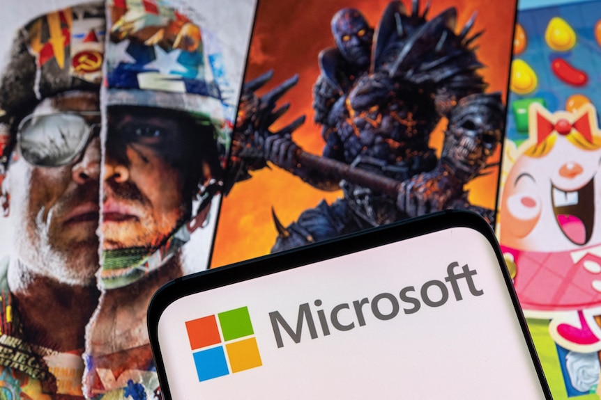 Microsoft logo in front of scenes from video games Call of Duty, World of Warcraft and Candy Crush