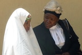 Nigerian child bride Wasila Tasi'u on trial for murder, pictured with defence lawyer