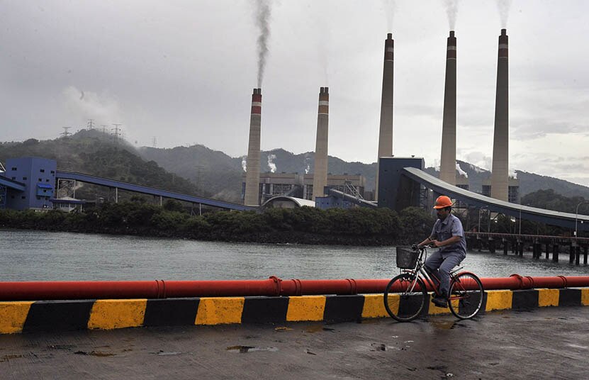 A worker checking in the area of the coal-fired power plant in Banten.